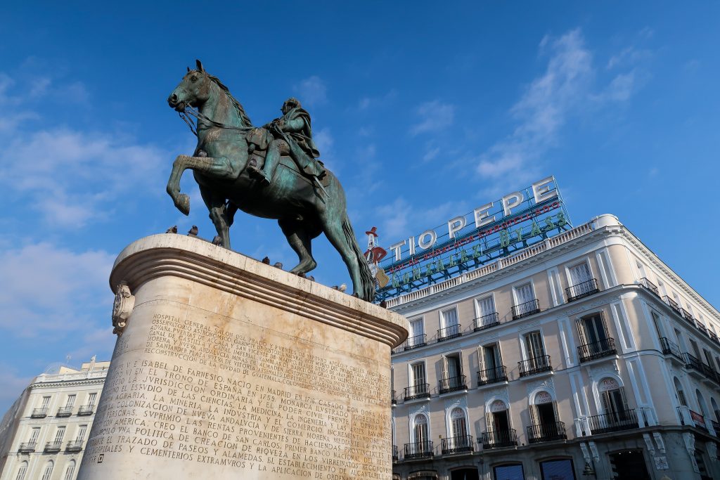 Statues and buildings in puerta del sol